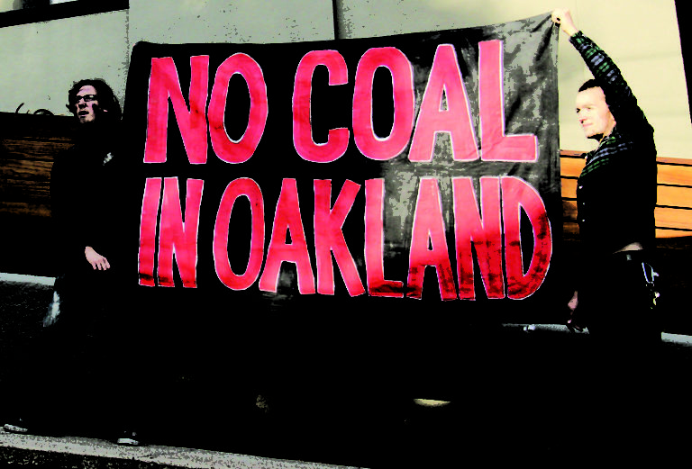 Protesters holding 'No Coal in Oakland' banner